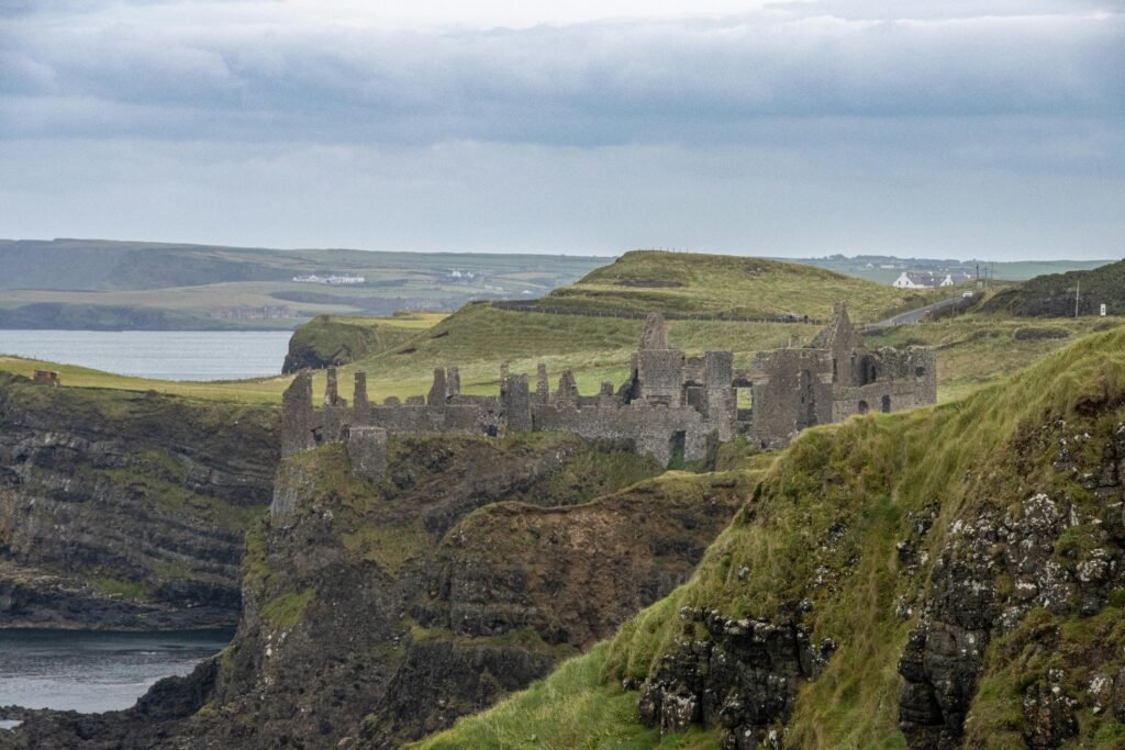 pexels-photo-28811398-28811398 Explore the dramatic ruins of Dunluce Castle perched on rugged cliffs in Ballintoy, Northern Ireland.
